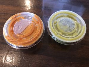 Both provided salsas are vegan. The reddish one is spicier! at La Mexicana in Newport