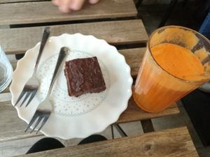 Vegan Brownie with fresh juice ( carrot, ginger and apple) at Taste in Luebeck