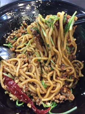 Minced bean ramen $6.9 - noodles with thick sauce, grounded peanuts, lettuce, "minced meat", mushrooms and a soup by the side. After mixing. at Vegandeli in Central Singapore