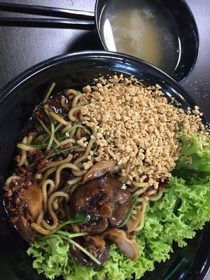 Minced bean ramen $6.9 - noodles with thick sauce, grounded peanuts, lettuce, "minced meat", mushrooms and a soup by the side. Before mixing. at Vegandeli in Central Singapore
