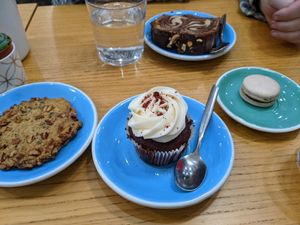 Cookie, red velvet cupcake, macaron, and marble cake in the back at Cloud Cakes - Mandar in Paris