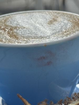 The cappuccino was served in a dirty cup with a lipstick stainn  at Cloud Cakes - Mandar in Paris