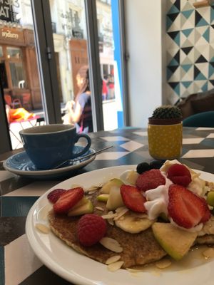 Vegan Pancakes with fruit, whipped cream, and maple syrup; americano on the side at Cloud Cakes - Mandar in Paris