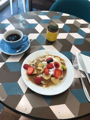 Vegan Pancakes with fruit, whipped cream, and maple syrup; americano on the side at Cloud Cakes - Mandar in Paris
