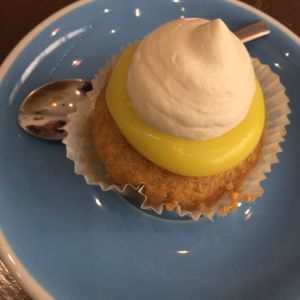 Lemon and blueberry cupcake which has a dollop of cream on top. at Cloud Cakes - Mandar in Paris