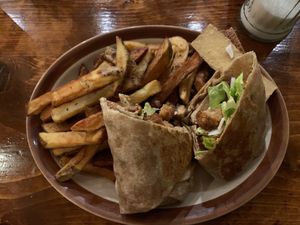 Kentucky fried wrap with vegan cheese and mayo, side of fries at Hunter Gatherer Vegetarian Diner in Regina