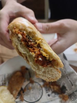 Huge bocata of Choripán with chimichurri at El Perro Gamberro in Madrid