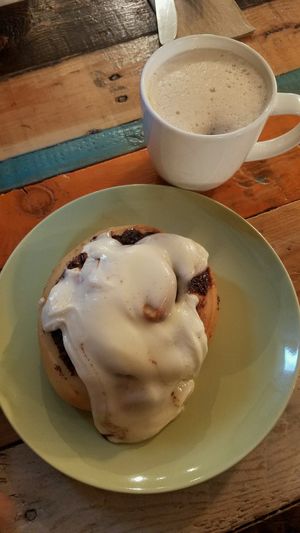 Vegan cinnamon roll with homemade chai w/ almond milk at Tough Cookie Bakery in Bastrop