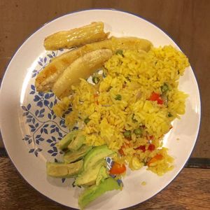Custom-made vegan veggie fried rice with avocado and fried bananas at Amores Brujos in Urubamba
