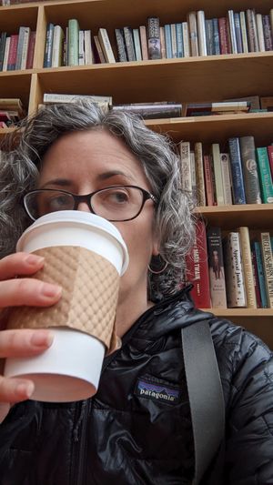 Drinking vegan chai with oat milk at Book Trader Cafe in New Haven