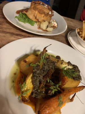 1) Braised rainbow carrots and polenta, and 2) sausage and ratatouille pie.  at Pembroke Arms in Salisbury
