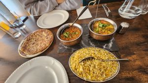Cumin rice, stuffed flat bread (not actual name), fried aubergine curry and jalfrezey at Veggie Perrins in Plymouth