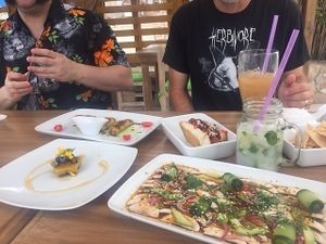 Sashimi (front), guava cake (left), BBQ dog and the coconut mojito with mint hand-picked from the deck garden. at Marcial by Mako in Cabo San Lucas