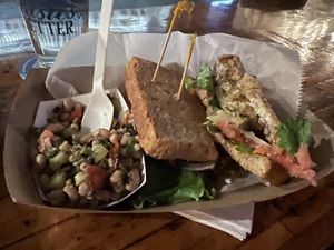 Vegan artichoke fish filet sandwich on rye bread with a side of black eyed pea saladd  at Smithtown Seafood in Lexington