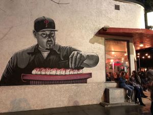 Mural outside Lou’s. Popular place. People hang out waiting to get in, even in the rain.  at Midtown Sushi in Sacramento