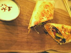 Vegan wrap with black beans, avocado served with coconut sour creme. 85.000 Rp at Happy Banana in 