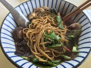 Shoyu ramen after noodles mixed up at The Workshop Vegetarian Cafe in North Vancouver