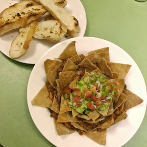 dry as heck garlic bread, and mouldy nachos at Sarangi Vegetarian Restaurant in Kathmandu