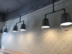 Upside down buckets as lamps at Gartnerei - Seefeldstrasse in Zurich