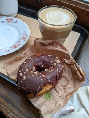 Doughnut and oat latte at Shakespeare and Company Cafe in Paris