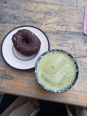 matcha latte with soya milk and donut at Shakespeare and Company Cafe in Paris