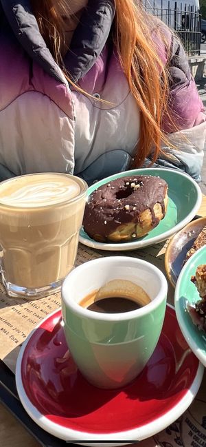 Oat latte, vegan donut   at Shakespeare and Company Cafe in Paris