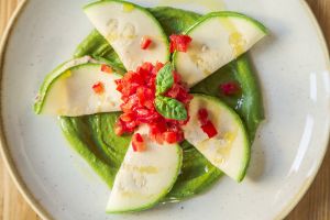 Ravioli with pesto

Zucchini ravioli stuffed with raw cheese and black olives, diced tomatoes, rocket and basil pesto at Solo Crudo - Prati in Rome