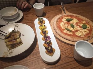 Tofu with grape juice, ginger, wild rice & lemon (centre), margherita pizza. at Ru if Vegan in Shanghai