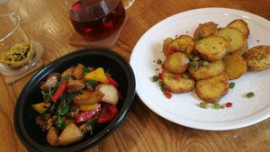 Tempeh with mushrooms and bell pepper. Pan fried spicy potatoes. at Ru if Vegan in Shanghai