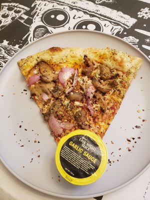 Vegan pizza and buttery garlic sauce at Mikey's Late Night Slice in Columbus