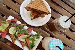 The club sandwich, cheese and beetroot humous toasties, acai-banana smoothie and the delicious banana and PB smoothie. at RawAttitude in Malaga