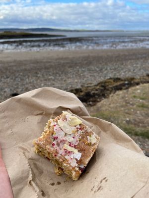 Cuthbert cake with a view 😍 at Pilgrims Coffee House in Lindisfarne