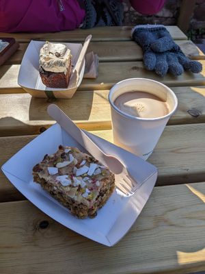Vegan Cuthberts Slice and Americano coffee with oat milk at Pilgrims Coffee House in Lindisfarne