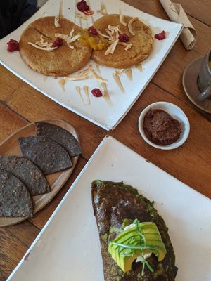 From left going clockwise: Flatbread, Pancakes, Chocolate Peanut Butter, Eggless Green Omelette at Vibe Cafe in Siem Reap