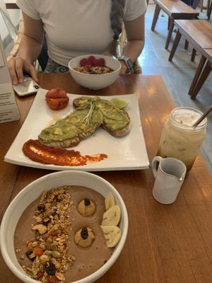 Chocolate smoothie bowl, açaí bowl, smashed avo, iced latte with cashew milk  at Vibe Cafe in Siem Reap