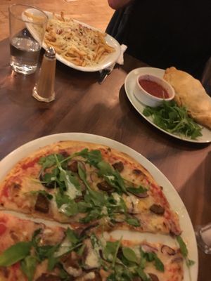 Blurry but seitan pizza, mushroom calzone and pizza fries  at Interval Bar in Sheffield