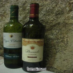 Unlimited wine with lunch! These were the two bottles plunked down onto our table.  Red for me, white for my husband. at Artemisa Sol - Huertas in Madrid