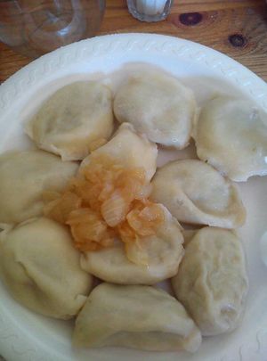 pierogi with lentils carrot and caremelized onions on top at Przystanek Pierogarnia - Rynek Debnicki in Krakow