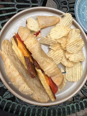 Croissant sandwich and chips   at Fancy Plants Cafe in Chicago