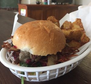 Breakfast burger and roast potatoes at Johnny Mack's Vegan Family Diner in Preston