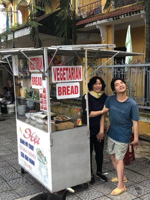 The wonderful owner and her son at Hoi Banh My Chay - Food Stall in Hoi An