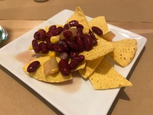 Nachos con frijoles y pico de gallo at La Huella Vegana in Alcala De Henares