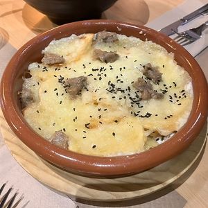Patatas tres quesos gratinadas  at La Huella Vegana in Alcala De Henares