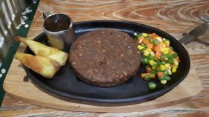 Tempeh steak with a pepper sauce at Mai3 Veggie Kitchen - Raya Tuban in Kuta