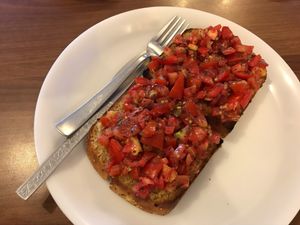 tomato garlic basil bruschetta in homemade brown bread 😍 super yum! (ask them for olive oil to make it vegan) at Nick's Italian Kitchen in Dharamshala