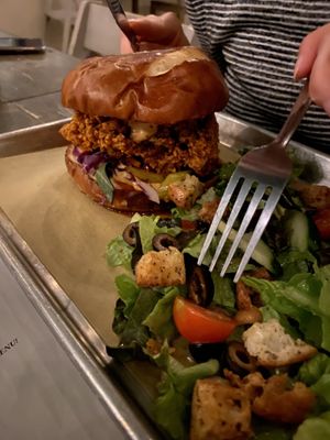 NASHVILLE HOT & CRISPY, side salad.  The burger was actually spicy and absolutely amazing with a pretzel bun   at The Beer Plant in Austin