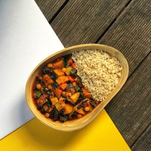 Moroccan Pumpkin Stew slow cooked with Moroccan spices, dry raisins, chickpeas, sweet potatoes, carrots, spinach, onions and with brown rice on the side at Sprout Korea Natural Whole Food Service in Seoul