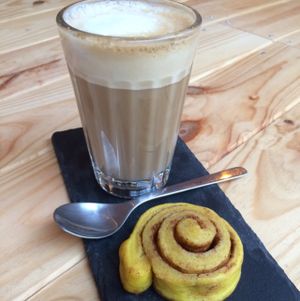 coffee and cinnamon bun  at Foodprintz Cafe in Lisbon