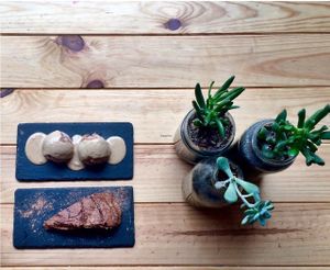Vegan banana chocolate chip ice cream with sweet peanut butter sauce and creamy avocado chocolate cake.  at Foodprintz Cafe in Lisbon
