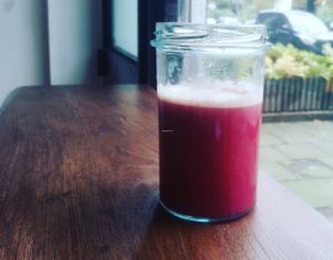 Cold-Pressed apple, red cabbage and ginger juice at Raw Nest in Krakow